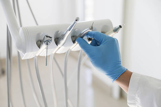 Professional Invisalign Clear Aligners technician working in East Rockaway, NY
